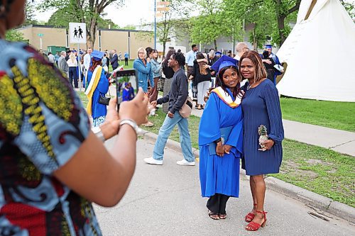 31052024
Simi Azeez, a bachelor of nursing with distinction graduate, has photos taken with her mom Adejoke Azeez after Brandon University&#x2019;s convocation for the Faculty of Health Studies at the BU Healthy Living Centre on Friday morning. 
(Tim Smith/The Brandon Sun)