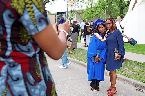 31052024
Simi Azeez, a bachelor of nursing with distinction graduate, has photos taken with her mom Adejoke Azeez after Brandon University&#x2019;s convocation for the Faculty of Health Studies at the BU Healthy Living Centre on Friday morning. 
(Tim Smith/The Brandon Sun)