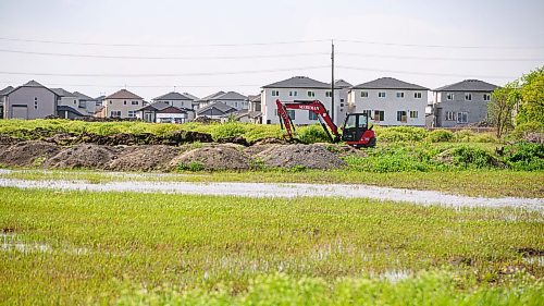 Mike Sudoma/Free Press
Construction continues behind a plot of undeveloped land at Meadowlands Place a newly developed housing development located just outside the city in West St Paul
May 31, 2024