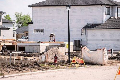 Mike Sudoma/Free Press
A construction worker nails the frame of a home in the new Meadowlands Place housing development in West St Paul
May 31, 2024