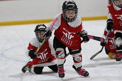 Players at the third annual Fierce Female Hockey camp skate while dragging teammates to work on power and balance at Flynn Arena on Sunday. The two-day camp saw more than 200 athletes take part. (Thomas Friesen/The Brandon Sun)