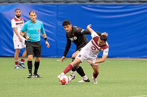 BROOK JONES / FREE PRESS.
Valour FC hosts visiting Vancouver FC in Canadian Premier League soccer action at Princess Auto Stadium in Winnipeg, Man., Sunday, June 2, 2024. Valour FC earned a 2-0 victory over Vancouver FC. Pictured: Valour FC midfielder Juan Sanchez controls the soccer ball as Vancouver FC midfielder Jose Navarro covers him during first half action.