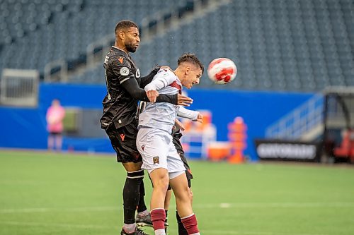 BROOK JONES / FREE PRESS.
Valour FC hosts visiting Vancouver FC in Canadian Premier League soccer action at Princess Auto Stadium in Winnipeg, Man., Sunday, June 2, 2024. Valour FC earned a 2-0 victory over Vancouver FC. Pictured: Valour FC defender Themia Antonoglou heads the soccer ball as Vancouver FC midfielder Mikaël Cantave covers him during first half action.