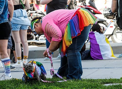 JOHN WOODS / FREE PRESS
Mum lifts the dress as the business is done at the Pride parade in Winnipeg Sunday, June 2, 2024. 

Reporter: tyler