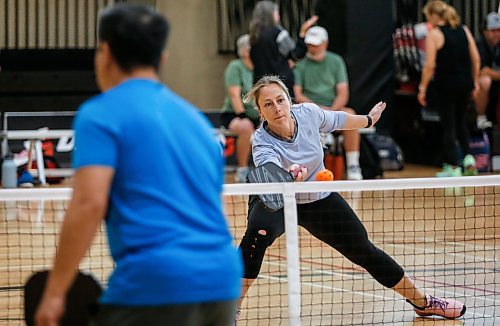 JOHN WOODS / FREE PRESS
Amy Lattimer warms up with partner Ben Starkey, not seen, for their match against Christine Esau and John Regan, left, in the U49 4.0 provincial pickleball tournament at Dakota Fieldhouse in Winnipeg Sunday, June 2, 2024. 

Reporter: josh