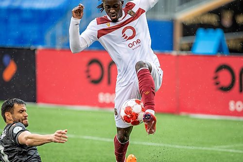 BROOK JONES / FREE PRESS.
Valour FC hosts visiting Vancouver FC in Canadian Premier League soccer action at Princess Auto Stadium in Winnipeg, Man., Sunday, June 2, 2024. Valour FC earned a 2-0 victory over Vancouver FC. Pictured: Valour FC forward Adbul Binate (right) controls the soccer ball as Vancouver FC forward Alejandro Diaz attempts the slide tackle during first half action.