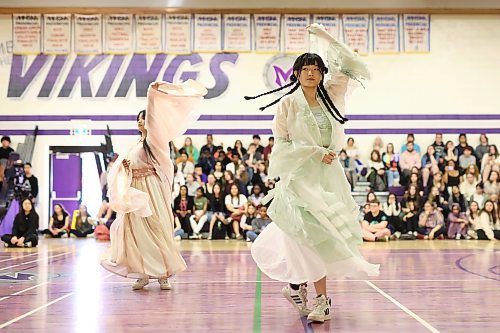 Grade 12 student Jing Jing Xu (right) performs as part of the Chinese pavilion during Culturama at Vincent Massey High School on Monday. The two-day event showcases and celebrates the wide variety of cultural backgrounds that make up the student population at the high school and includes performances and cuisine from cultures around the world. See story on Page A3. (Tim Smith/The Brandon Sun)