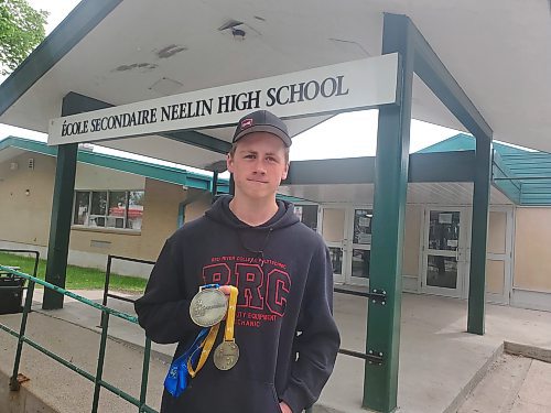 Neelin High School Grade 12 student Oliver Sawatsky poses with his Skills Manitoba and Skills Canada gold medals in Automobile Technology on Tuesday. Photos: Abiola Odutola/The Brandon Sun