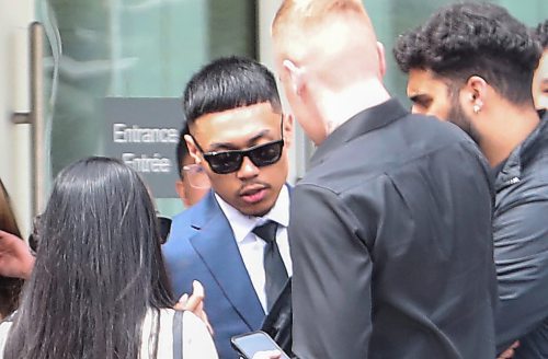 RUTH BONNEVILLE / FREE PRESS

Photo of Nicholas Baldovi as he leaves the Law Courts building break surrounded by friends and family during break in proceedings.  June 4, 2024