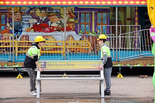 Workers were busy Tuesday setting up for the opening day of the Manitoba Summer Fair at the Keystone Centre grounds. (Tim Smith/The Brandon Sun)