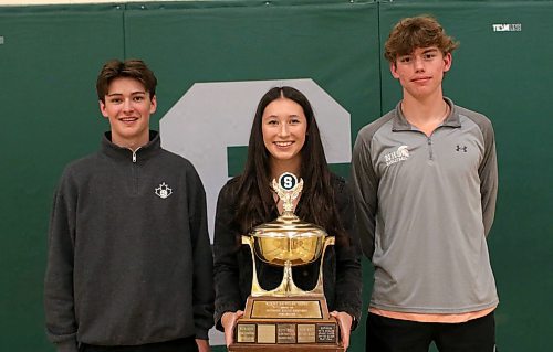 Junior Martine, from left, Tyra Lasuik and Kal-El Wilson pose with the Neelin athlete of the year trophy Tuesday night following their awards event. (Thomas Friesen/The Brandon Sun)