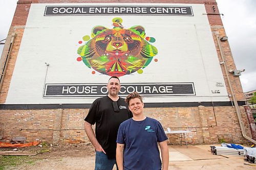 BROOK JONES / FREE PRESS
The Social Enterprise Centre which was founded in 2012 celebrated the 100th anniversary of the building that houses the organization in Winnipeg, Man., Tuesday, June 4, 2024. The former Canadian Pacific Railway Post Office Postal Station A building at 765 Main St. was built in 1924. Sean Hogan (left) who is the president of SEC and executive director of BUILD Inc. is pictured with Kalen Taylor who is a board member with SEC and is the executive director of Purpose Construction. The duo were pictured in front of a mural designed by Shaun Vincent and painted by Ryley Thiessen and Nereo Zerro.