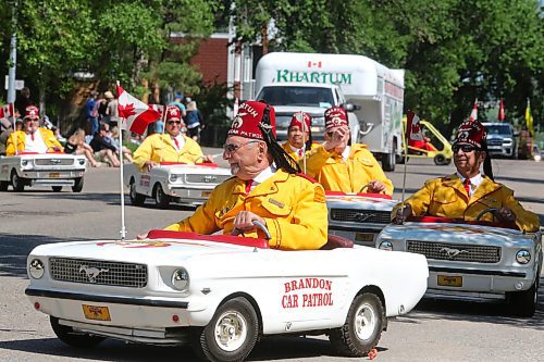 Members of the Brandon Shrine Club's Car Patrol get in formation as this year's Travellers' Day Parade makes its way down 13th Street Saturday morning. (Kyle Darbyson/The Brandon Sun)