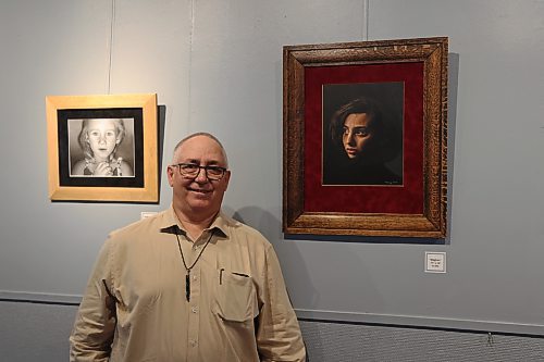 Artist Brad Mummery with his oil painting "Meghan." his exhibition "Earth, Fire, Water" will be on display at ArtsForward Neepawa for the month of June. (Charlotte McConkey/The Brandon Sun)