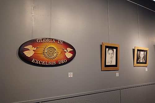 A wood carving of Mummery's displayed next to some of his drawings and paintings. An exhibition opening lunch is scheduled for June 6, with all funds raised being donated to Neepawa Collegiate's art program. (Charlotte McConkey/The Brandon Sun)