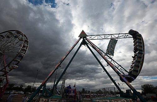 Fairgoers aren’t deterred by the storm clouds as they take in the opening evening of the Manitoba Summer Fair at the Keystone Centre on Wednesday. The fair runs until Sunday. (Tim Smith/The Brandon Sun)