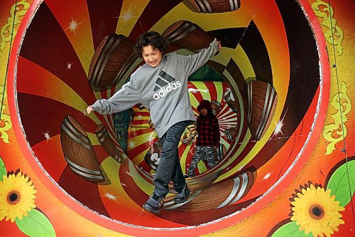 Harlon Leask manoeuvres his way through the Cuckoo Haus on the midway. (Tim Smith/The Brandon Sun)