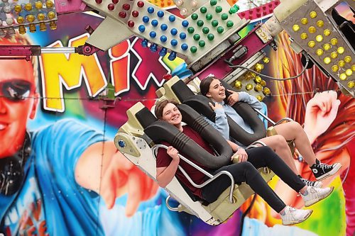 05062024
Loughlan McMullan and Veronika Hrytsenko ride the Re-Mix on the midway during the opening evening of the Manitoba Summer Fair at the Keystone Centre on Wednesday. The fair runs until Sunday.
(Tim Smith/The Brandon Sun)