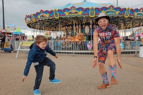 05062024
Seven-year-old Parker Flett dances with performer Spandy Andy during the opening evening of the Manitoba Summer Fair at the Keystone Centre on Wednesday. The fair runs until Sunday.
(Tim Smith/The Brandon Sun)