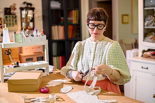 Mike Sudoma/Free Press
Melanie Wesley cuts fabric for a sewing project in her workshop Wednesday morning
June 5, 2024