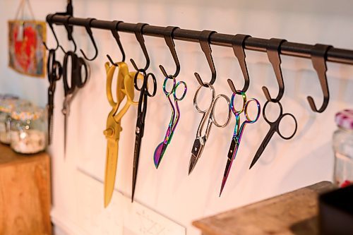 Mike Sudoma/Free Press
A variety of different sizes of scissors hang above on Melanie Wesley sewing machine in her workshop Wednesday morning
June 5, 2024