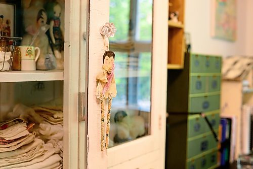 Mike Sudoma/Free Press
A paper cache doll hangs on a cupboard doorknob inside Melanie Wesleys workshop Wednesday morning
June 5, 2024