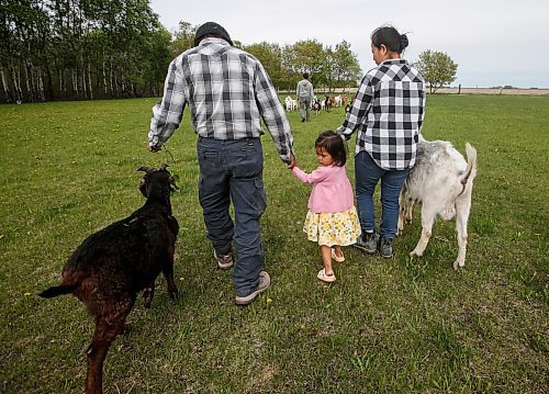 JOHN WOODS / FREE PRESS
ThaMu Eh&#x573; daughter Willow walks with her grandfather Doh Htoo Eh, left, and grandmother Nyo You San, at their multi-generational home north of Stonewall Tuesday, May 21, 2024. 

Reporter: gabby