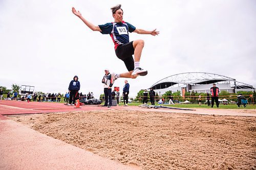 Mike Sudoma/Free Press
A participant in the long jump event flies through the air at the Dairy Farmers of Manitoba Provincial Track and Field Championship Thursday afternoon
June 6, 2024