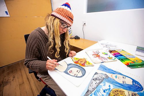 MIKAELA MACKENZIE / FREE PRESS

Artist-in-residence Jenna Bourgoing works on drawings at Artbeat Studio on Monday, April 29, 2024.  This six-month residency, which culminates in a group show (happening on June 20th this year), supports artists whose mental health, social connection, and income make it difficult for them to otherwise have studio space. There are six artists in residence this year, and they are the 38th cohort to have gone through the program.

Standup.