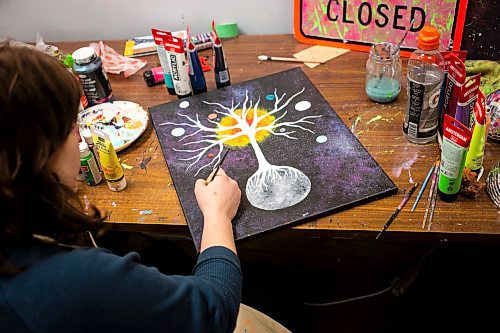 MIKAELA MACKENZIE / FREE PRESS

Artist-in-residence Bijou Marcoux works on a painting at Artbeat Studio on Monday, April 29, 2024.  This six-month residency, which culminates in a group show (happening on June 20th this year), supports artists whose mental health, social connection, and income make it difficult for them to otherwise have studio space. There are six artists in residence this year, and they are the 38th cohort to have gone through the program.

Standup.