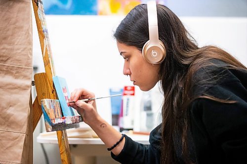 MIKAELA MACKENZIE / FREE PRESS

Artist-in-residence Kayla Martinez works on a painting at Artbeat Studio on Monday, April 29, 2024.  This six-month residency, which culminates in a group show (happening on June 20th this year), supports artists whose mental health, social connection, and income make it difficult for them to otherwise have studio space. There are six artists in residence this year, and they are the 38th cohort to have gone through the program.

Standup.