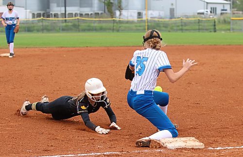 Westman Magic baserunner Mya Duncan-Gagnon dives into the bag for a triple as Nova Scotia 2 third baseman Avery MacNeil tries to get her glove on a quick throw from the plate during their bottom bracket semifinal game in the Softball Canada under-15 girls national championship at Ashley Neufeld Softball Complex on Aug. 13, 2023. Duncan-Gagnon was safe on the play as the Magic won 5-4. (Perry Bergson/The Brandon Sun)