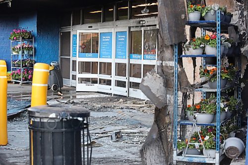 Scorched glass doors and burnt rubble mark the entrance of Brandon's Walmart shopping centre at the Corral Centre on Friday, after an early-morning fire was set to an adirondack chair outside the building. The fire soon spread to the building and damaged the exterior. (Matt Goerzen/The Brandon Sun)