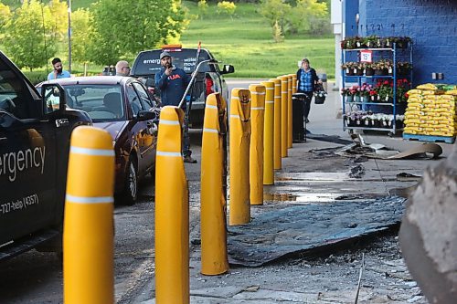 Heat from an early-morning fire at the Walmart in Brandon's Corral Centre melted several hard-plastic barriers outside the structure, seen here on Friday morning. (Matt Goerzen/The Brandon Sun)