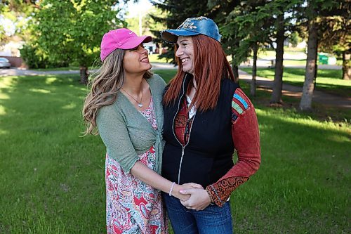 Anastasia Jane Gibson and Wendy Deanne Friesen pose for photos after their wedding dress rehearsal at Rideau Park on Thursday evening. The couple will be getting married as part of Pride in the Park following the Pride March on Saturday, June 15th. The wedding is part of Brandon Pride’s celebration of 20 years of legalized same sex marriage in Manitoba. 
(Tim Smith/The Brandon Sun)
