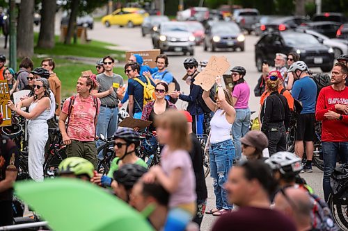 Mike Sudoma/Free Press
Cycling advocates hold up signs on the front lines of a blockade Friday afternoon The blockade blocked traffic travelling on either side of Wellington Crescent after a cyclist was killed at the intersection this past Thursday
June 7, 2024