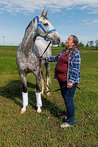 MIKE DEAL / FREE PRESS
Explosive with trainer Lise Pruitt at Assinboia Downs Friday morning.
See George Williams story
240607 - Friday, June 07, 2024.