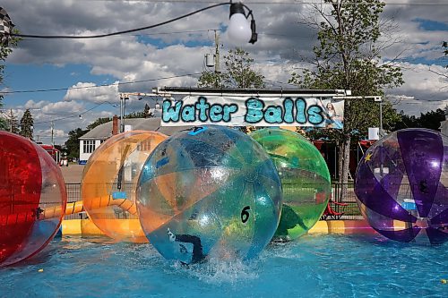 07062024
Kids play in the water balls on the midway during the Manitoba Summer Fair at the Keystone Centre grounds on Friday.
(Tim Smith/The Brandon Sun)