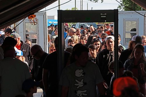 07062024
Visitors to the Manitoba Summer Fair on Friday pass through a metal detector as part of increased security for the fair at the Keystone Centre grounds Security guards also checked fair-goers bags before they could enter.
(Tim Smith/The Brandon Sun)