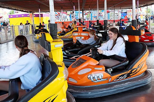 07062024
Fair-goers ride the bumper cars on the midway during the Manitoba Summer Fair at the Keystone Centre grounds on Friday.
(Tim Smith/The Brandon Sun)