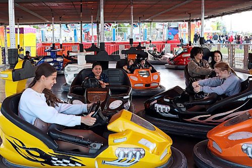 07062024
Fair-goers ride the bumper cars on the midway during the Manitoba Summer Fair at the Keystone Centre grounds on Friday.
(Tim Smith/The Brandon Sun)