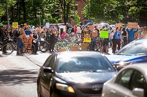 Mike Sudoma/Free Press
Traffic turns around along Wellington Crescent as cycling advocates take a stand Friday afternoon after a cyclist was killed at the intersection of Cockburn and Wellington Crescent this past Thursday
June 7, 2024