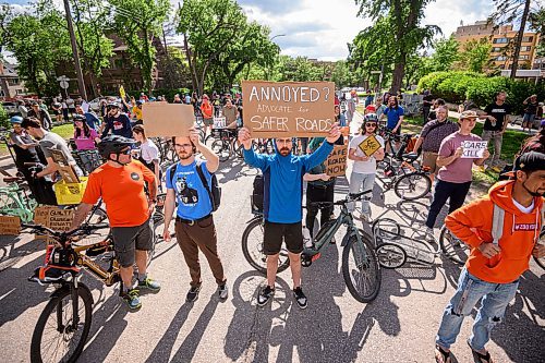 Mike Sudoma/Free Press
Cycling advocates hold up signs on the front lines of a blockade Friday afternoon The blockade blocked traffic travelling on either side of Wellington Crescent after a cyclist was killed at the intersection this past Thursday
June 7, 2024