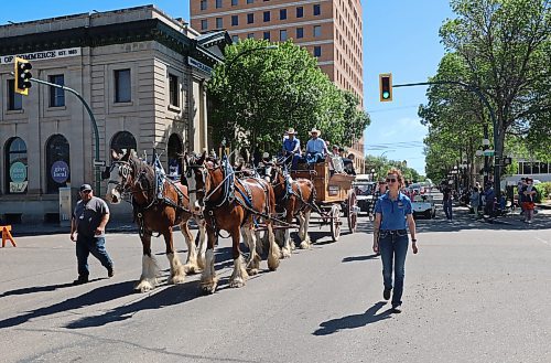 Horses pull a carriage carrying representatives from the Provincial Exhibition of Manitoba. (Charlotte McConkey/The Brandon Sun)