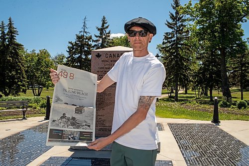 BROOK JONES / FREE PRESS
The Royal Winnipeg Rifles Association host an 80th D-Day anniversary ceremony at Vimy Ridge Park in Winnipeg, Man., Saturday, June 8, 2024. Pictured: Winnipeg resident Jonathan Williams holds a copy of the Free Press following the ceremony. His grandfather Allan Williams, who was born in 1923 and died in 2005, was an infrantry soldier with the Royal Winnipeg Rifles during the Commonwealth invasion of Normandy, France on D-Day June 6, 1944 and is featured in a Library and Archives Canada photo that appeared on the front page of section 49.8 of the Free Press Saturday, June 1, 2024.