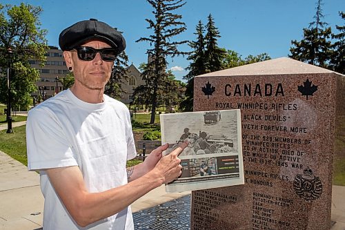 BROOK JONES / FREE PRESS
The Royal Winnipeg Rifles Association host an 80th D-Day anniversary ceremony at Vimy Ridge Park in Winnipeg, Man., Saturday, June 8, 2024. Pictured: Winnipeg resident Jonathan Williams points to Library and Archives Canada photo that includes his late his late grandfather Allan Williams who was an infrantry soldier with the Royal Winnipeg Rifles during the Commonwealth invasion of Normandy, France on D-Day June 6, 1944. The photo appeared on the front page of section 49.8 of the Free Press Saturday, June 1, 2024.