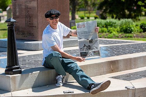 BROOK JONES / FREE PRESS
The Royal Winnipeg Rifles Association host an 80th D-Day anniversary ceremony at Vimy Ridge Park in Winnipeg, Man., Saturday, June 8, 2024. Pictured: Winnipeg resident Jonathan Williams smiles as he holds a copy of the Free Press following the ceremony. His grandfather Allan Williams, who was born in 1923 and died in 2005, was an infrantry soldier with the Royal Winnipeg Rifles during the Commonwealth invasion of Normandy, France on D-Day June 6, 1944 and is featured (wearing helmet with vegetation camouflage on it) in a Library and Archives Canada photo that appeared on the front page of section 49.8 of the Free Press Saturday, June 1, 2024.