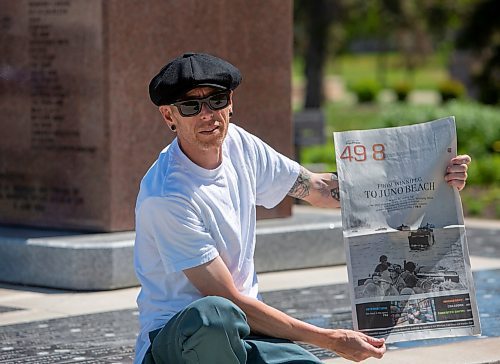BROOK JONES / FREE PRESS
The Royal Winnipeg Rifles Association host an 80th D-Day anniversary ceremony at Vimy Ridge Park in Winnipeg, Man., Saturday, June 8, 2024. Pictured: Winnipeg resident Jonathan Williams holds a copy of the Free Press following the ceremony. His grandfather Allan Williams, who was born in 1923 and died in 2005, was an infrantry soldier with the Royal Winnipeg Rifles during the Commonwealth invasion of Normandy, France on D-Day June 6, 1944 and is featured (wearing helmet with vegetation camouflage on it) in a Library and Archives Canada photo that appeared on the front page of section 49.8 of the Free Press Saturday, June 1, 2024.