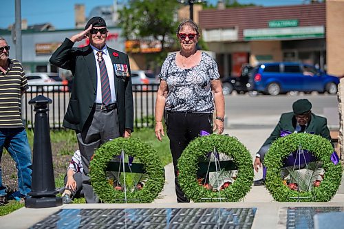 BROOK JONES / FREE PRESS
The Royal Winnipeg Rifles Association host an 80th D-Day anniversary ceremony at Vimy Ridge Park in Winnipeg, Man., Saturday, June 8, 2024. Pictured: Donna Reid, who is a niece of the late Sgt. James Allan (Jim) Reid, stands after laying a wreath on behalf of veteran famiiles during the commemoration ceremony as retired Maj.-Gen. Dennis Tabbernor, who is a former commanding officer of the RWR, does a military hand salute. Donna said Jim was captured by the Germans, along with two of his brothers. They were known as the Fighting Reids. Two brothers survived, but Jim was executed.