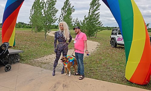 Brandon Pride vice-chairperson Ian Ternovetsky poses with his dog Kala and this year's Grand Marshall of the Pride March Flora Hex. (Charlotte McConkey/The Brandon Sun)